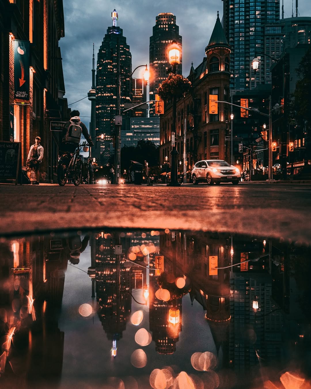 Gooderham building reflection in puddle Toronto by @itsonlykotsy